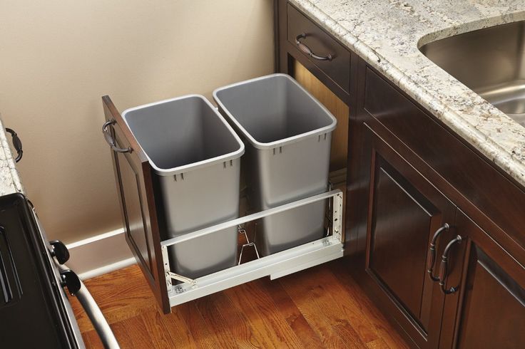 A slide-out trash, and recycling bin is handy when you need it and hidden when you don't. These pull-out bins are great space savers for tiny house kitchens.