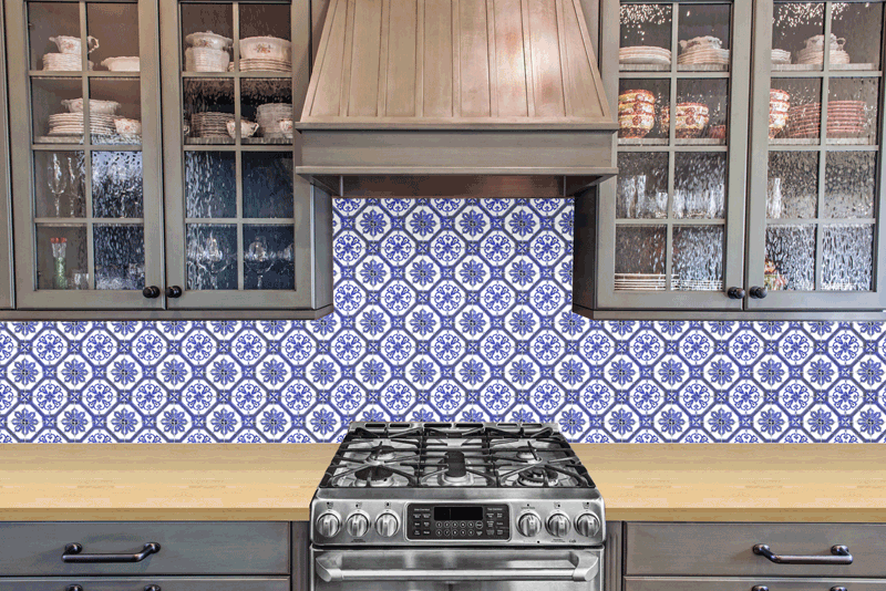 This gif shows the considerable difference the backsplash and countertop choices have on the look and feel of a tiny house kitchen.
