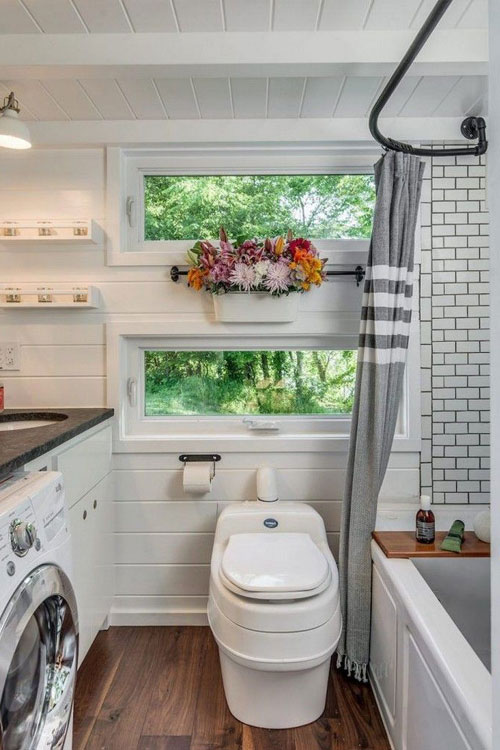 off grid tiny house bathroom with composting toilet and laundry