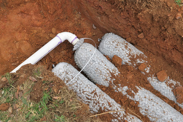 drain line connections for a septic tank