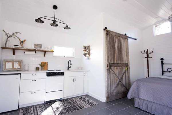 kitchen and bedroom in a converted shed house for living