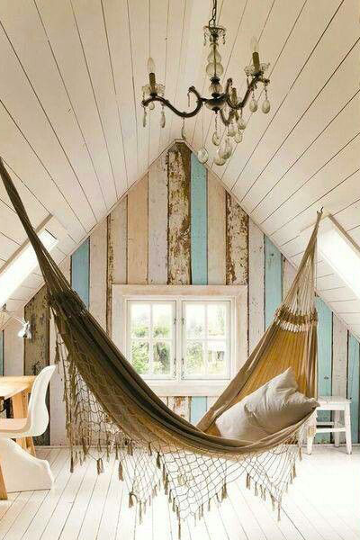 A hammock in your whitewashed A-frame loft provides a different place to sleep, especially if you use the space as an office.