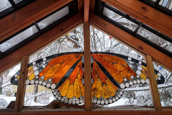 stained glass butterfly window in tiny house