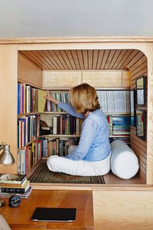 tiny house reading space with bookshleves