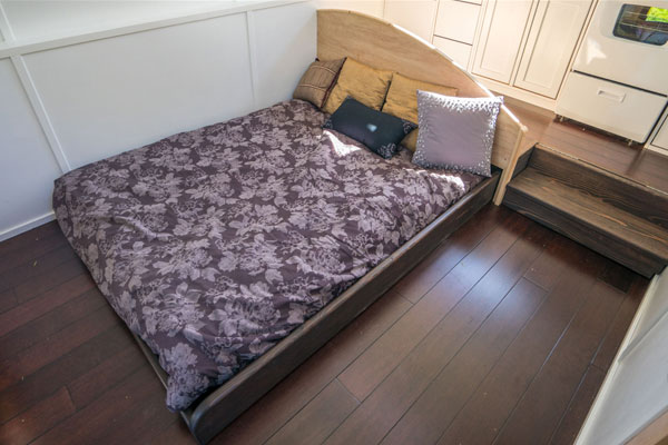 open pull out bed in a tiny house