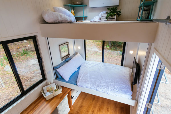 tiny house with loft space and elevator bed