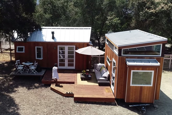 two tiny houses with a shared deck