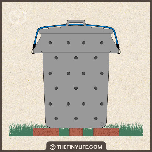 set trashcan composter up on bricks for airflow