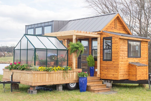tiny houses connected with a greenhouse