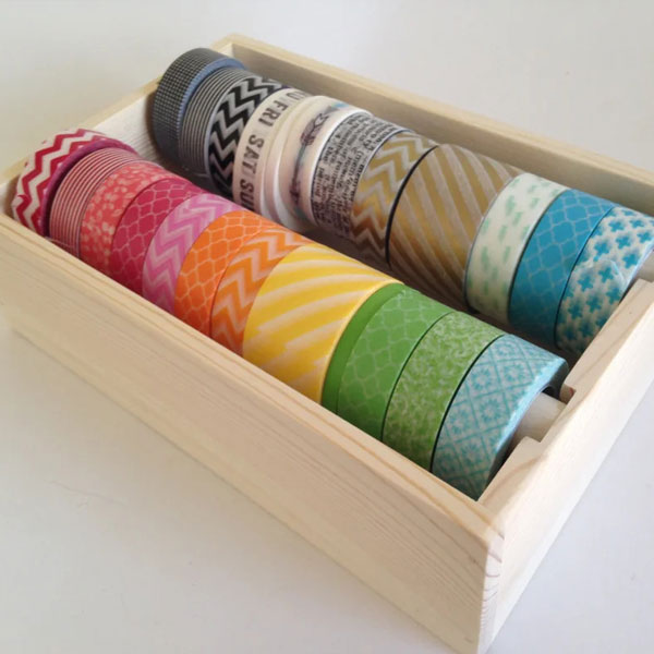 craft tape organized in boxes