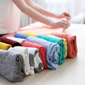 roll up clothes to save closet space