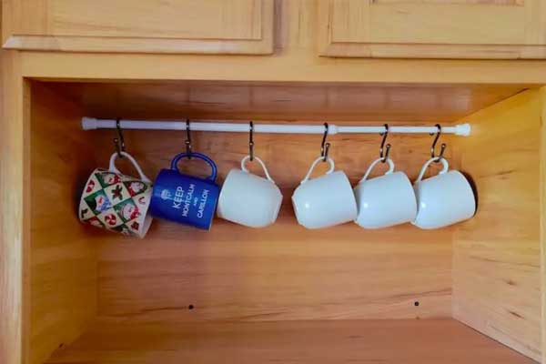 hang cups on tension rods