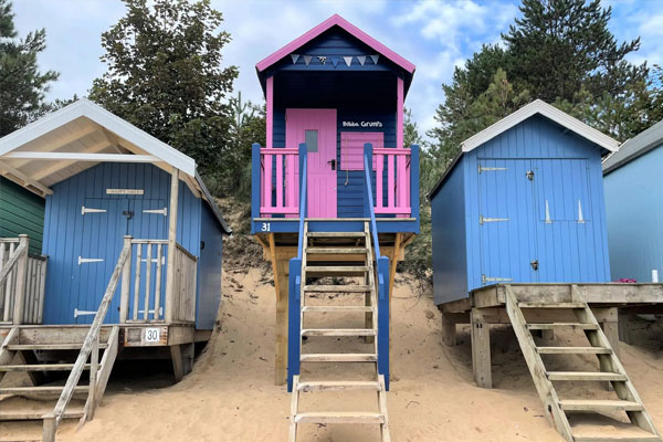 tiny house on stilts at beach