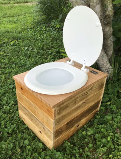 toilet seat attached to composting toilet