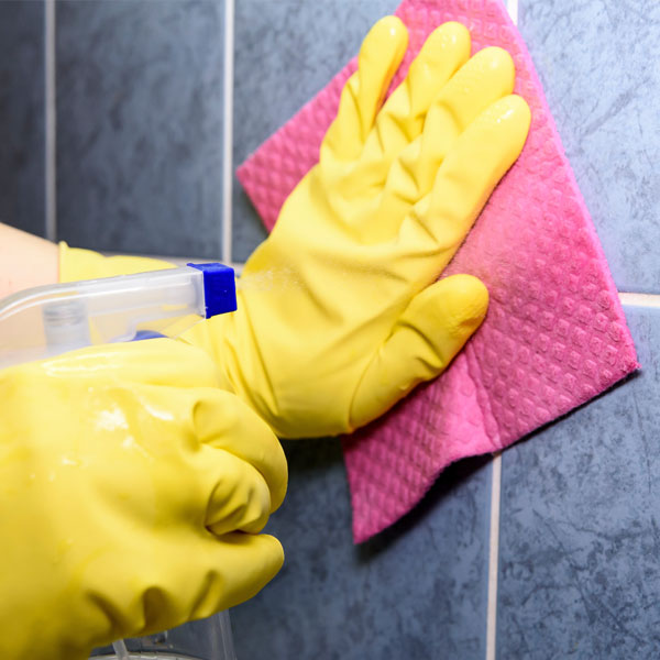 cleaning tiles during spring decluttering