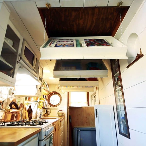 fold-out ceiling shelves in tiny house